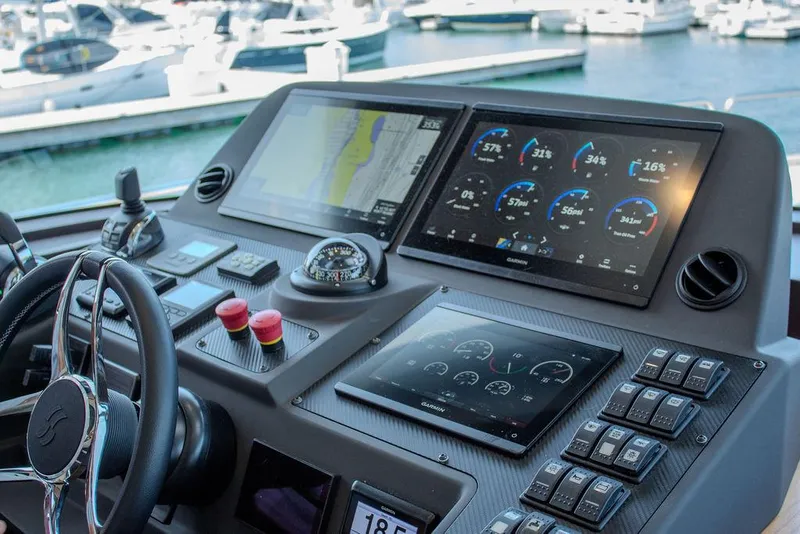 Slide: The Image of Sirena 58 Flybridge 2022 yacht helm with advanced navigation displays and controls. - 16