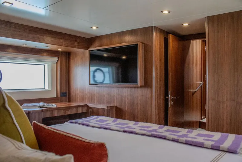 Slide: The Image of Luxurious cabin interior of 2022 Sirena 58 Flybridge yacht with wood paneling and modern amenities. - 20