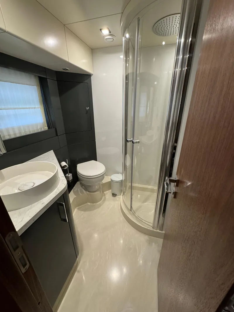 Slide: The Image of Modern bathroom in 2022 Sirena 58 Flybridge yacht with shower and sink. - 25