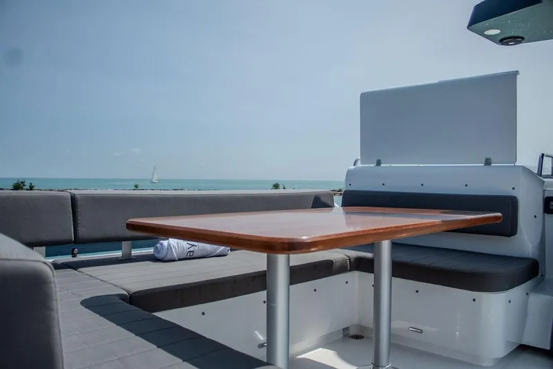 Slide: The Image of Sirena 58 Flybridge 2022 yacht deck with seating and ocean view. - 35