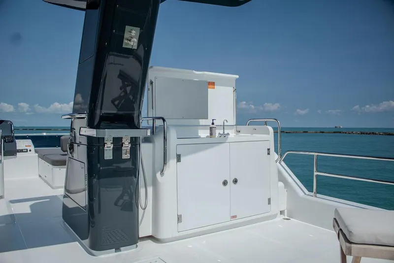 Slide: The Image of Sirena 58 Flybridge 2022 yacht deck with ocean view and sleek design. - 36