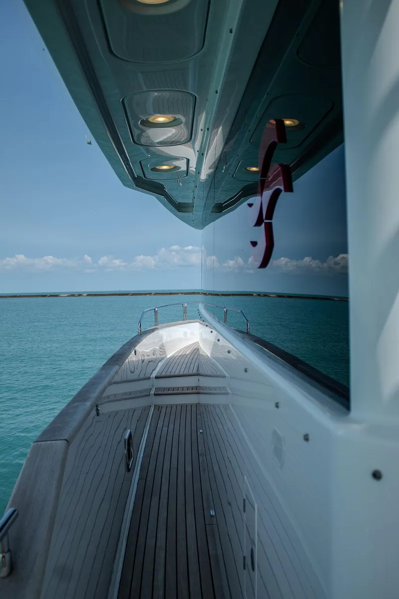 Slide: The Image of Sirena 58 Flybridge 2022 yacht, sleek design, wooden deck, ocean view. - 42