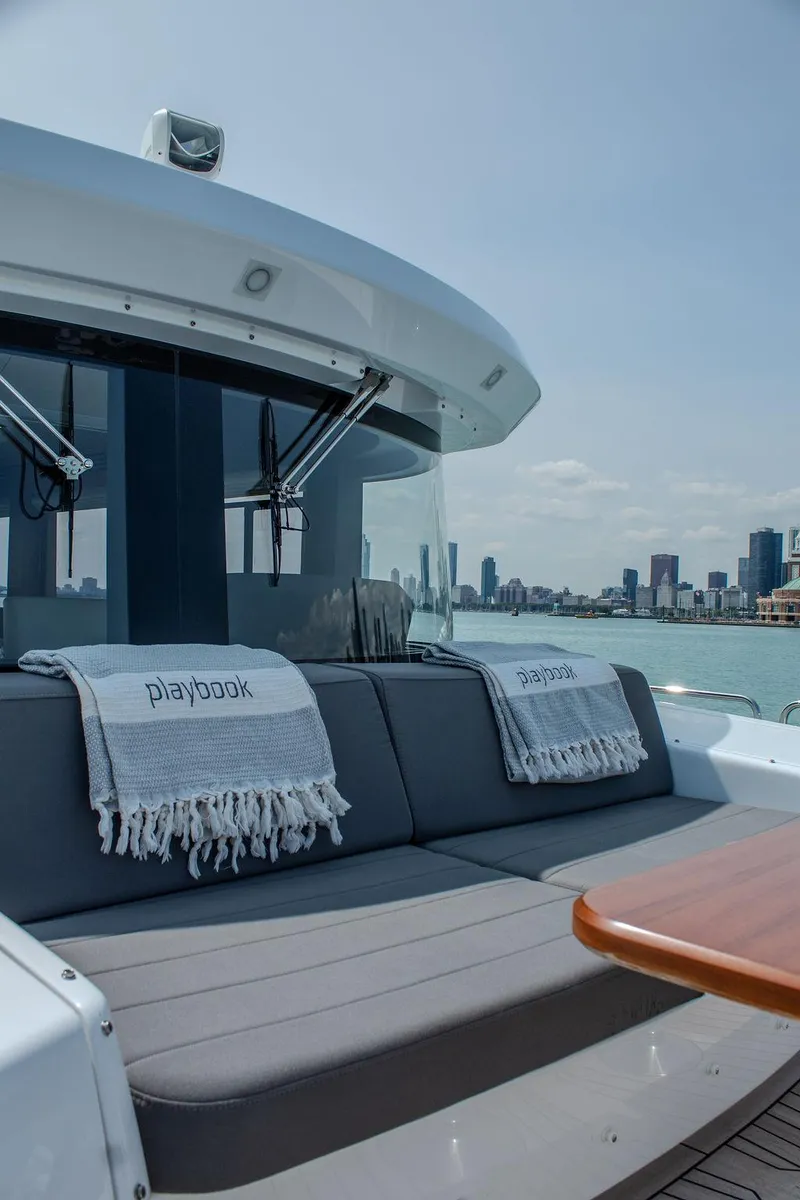 Slide: The Image of Luxurious Sirena 58 Flybridge yacht with city skyline view, 2022 model. - 44