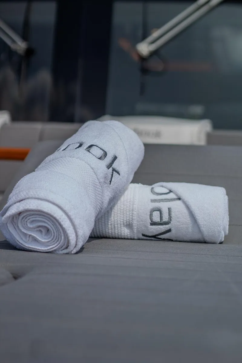 Slide: The Image of Rolled towels on Sirena 58 Flybridge yacht, 2022 model, with luxurious seating. - 46