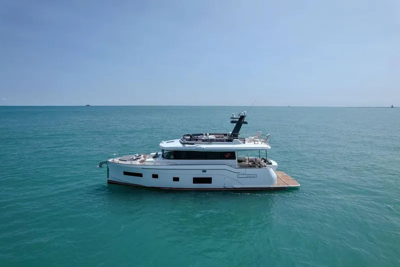 Slide: The Image of Sirena 58 Flybridge 2022 yacht cruising on calm blue sea. - 5