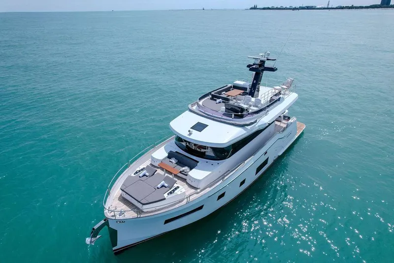 Slide: The Image of 2022 Sirena 58 Flybridge yacht cruising on open sea. - 6