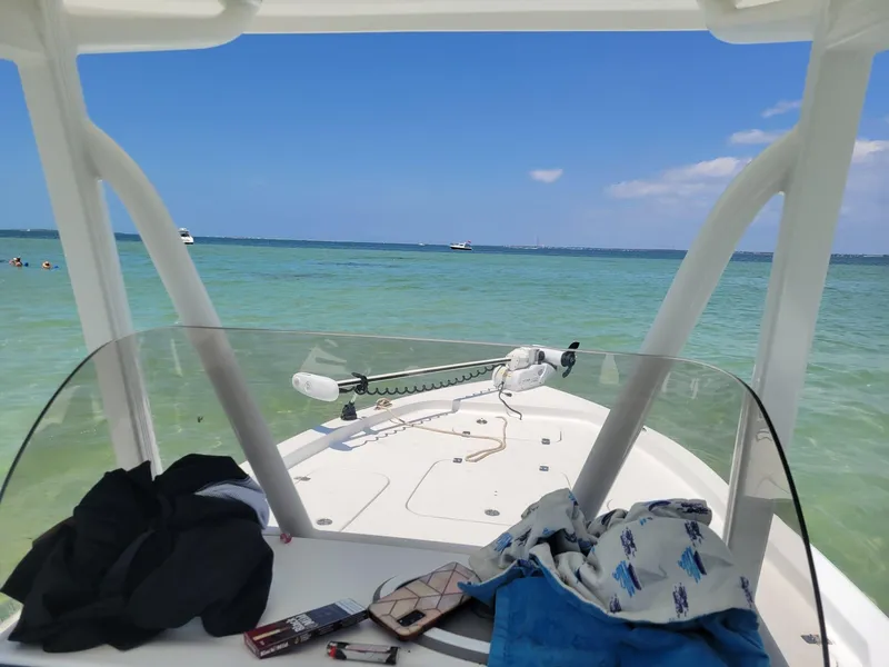 Slide: The Image of 2020 Sea Hunt BX 25 BR boat on clear blue water, sunny day, with gear on deck. - 16