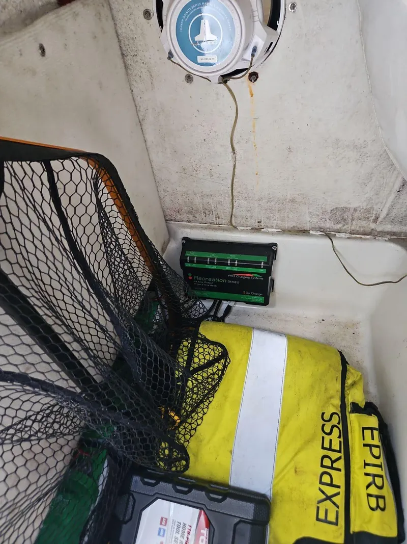 Slide: The Image of 2020 Sea Hunt BX 25 BR boat interior with EPIRB and safety equipment. - 21