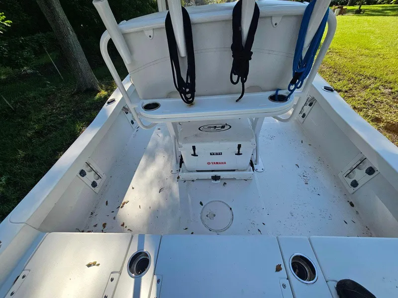 Slide: The Image of 2020 Sea Hunt BX 25 BR boat interior with seating and storage compartments. - 24