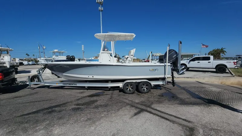 Slide: The Image of 2020 Sea Hunt BX 25 BR boat on trailer in marina parking lot. - 4