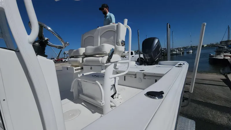 Slide: The Image of 2020 Sea Hunt BX 25 BR boat at dock, featuring spacious seating and modern design. - 42