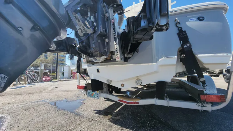 Slide: The Image of 2020 Sea Hunt BX 25 BR boat on trailer, showing engine and rear view. - 44