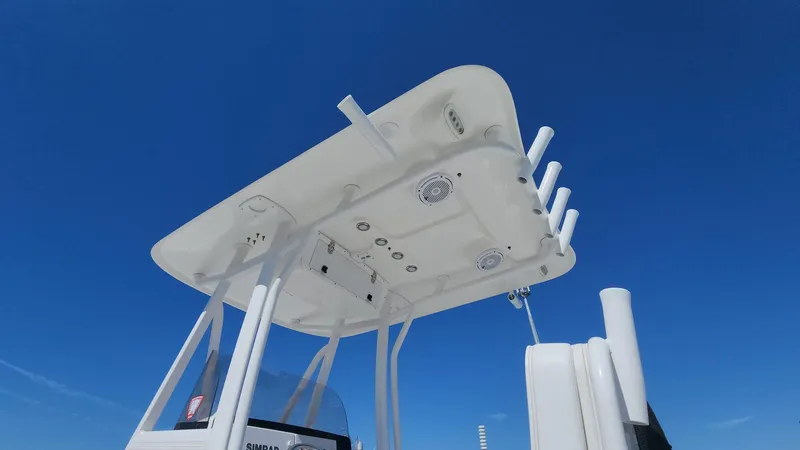 Slide: The Image of 2020 Sea Hunt BX 25 BR boat T-top against clear blue sky. - 47