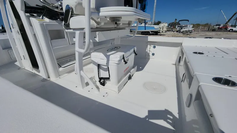 Slide: The Image of 2020 Sea Hunt BX 25 BR boat interior with seating and storage. - 7