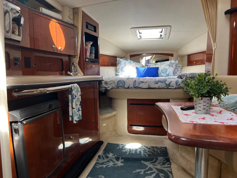 Slide: The Image of Interior of 2006 Sea Ray 320 Sundancer with cozy cabin and modern amenities. - 5