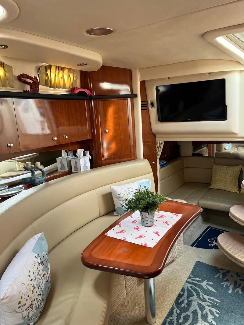 Slide: The Image of Luxurious interior of 2006 Sea Ray 320 Sundancer yacht with elegant seating and modern amenities. - 6