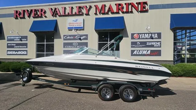 Slide: The Image of 2001 Reinell 240 C boat on trailer at River Valley Marine dealership. - 1