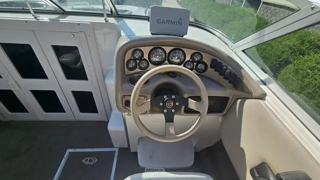 Slide: The Image of 2001 Reinell 240 C boat dashboard with Garmin navigation system. - 10