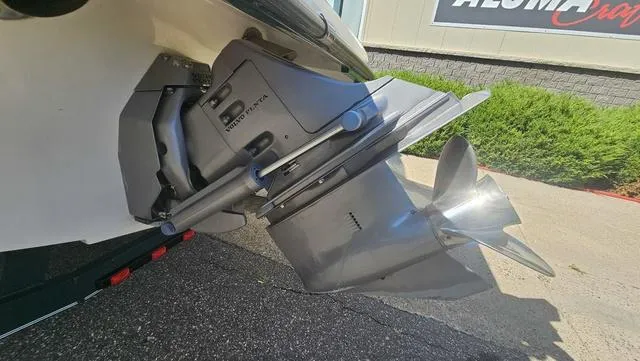 Slide: The Image of Outboard motor of a 2001 Reinell 240 C boat, displayed on a trailer. - 22