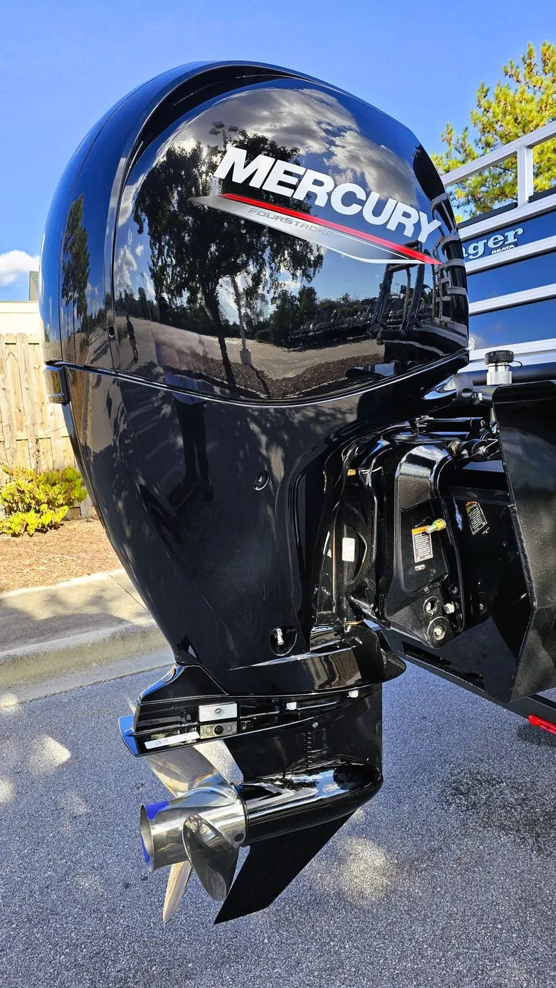 Slide: The Image of 2024 Ranger Reata 223F with Mercury outboard motor, shiny black finish. - 5