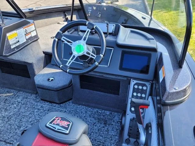 Slide: The Image of 2024 Ranger VX1788 WT boat interior with steering wheel and control panel. - 3