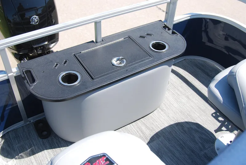 Slide: The Image of 2024 Ranger Reata 220F boat interior with storage compartment and cup holders. - 10