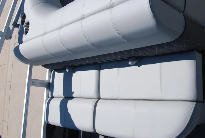 Slide: The Image of 2024 Ranger Reata 220F boat seating with light gray upholstery. - 11