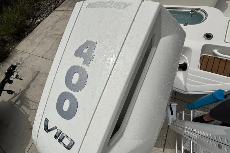 Slide: The Image of 2024 Ranger 2600 Bay boat with Mercury 400 V10 engine, wet with water droplets. - 15