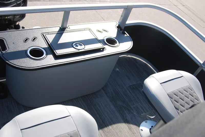 Slide: The Image of 2024 Ranger Reata 220F boat interior with seating and storage console. - 10