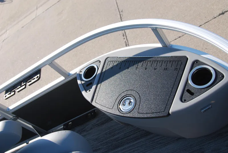 Slide: The Image of 2024 Ranger Reata 220F boat console with cup holders and measurement panel. - 15