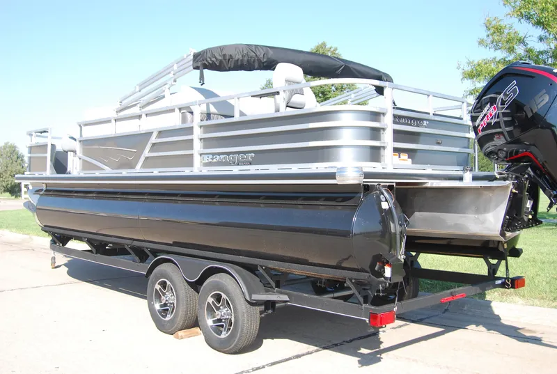 Slide: The Image of 2024 Ranger Reata 220F pontoon boat on trailer, rear view, outdoors. - 3