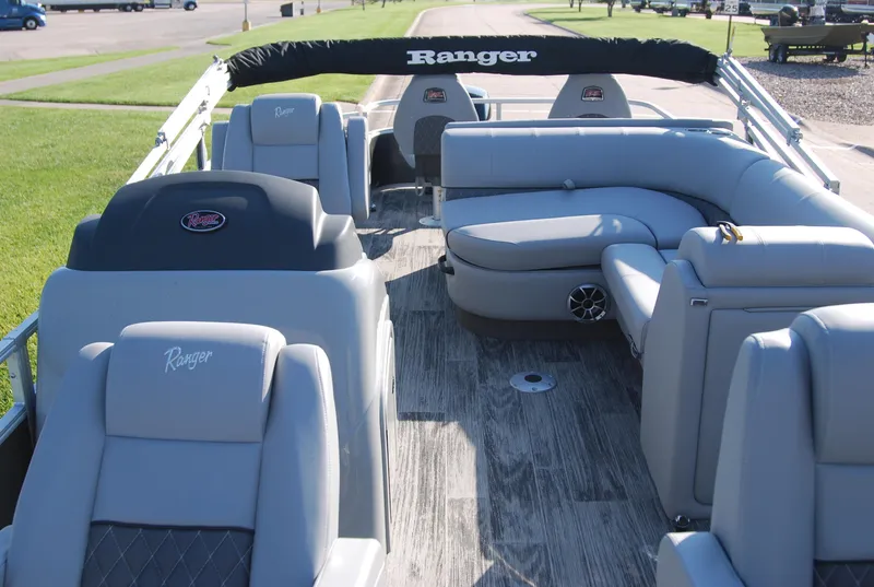 Slide: The Image of 2024 Ranger Reata 220F pontoon boat with spacious seating and modern design. - 5