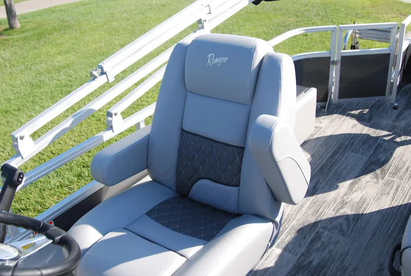Slide: The Image of 2024 Ranger Reata 220F boat seat with gray upholstery and diamond pattern design. - 8