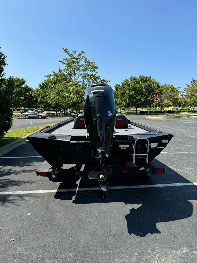 Slide: The Image of 2024 Ranger RT178C boat in parking lot, rear view with motor. - 5