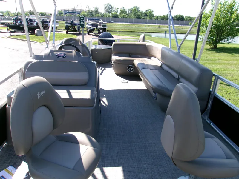 Slide: The Image of 2024 Ranger Reata 200F pontoon boat interior with comfortable seating and spacious layout. - 3