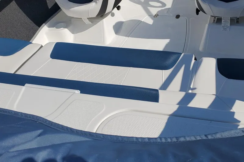 Slide: The Image of 2024 Tahoe 185 S boat interior with blue and white seating. - 32