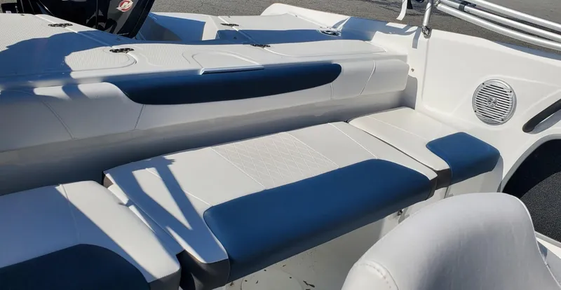 Slide: The Image of 2024 Tahoe 185 S boat interior with cushioned seating and speaker. - 37