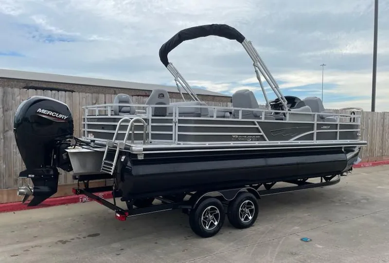 Slide: The Image of 2024 Ranger Reata 220F pontoon boat with Mercury outboard motor on trailer. - 6