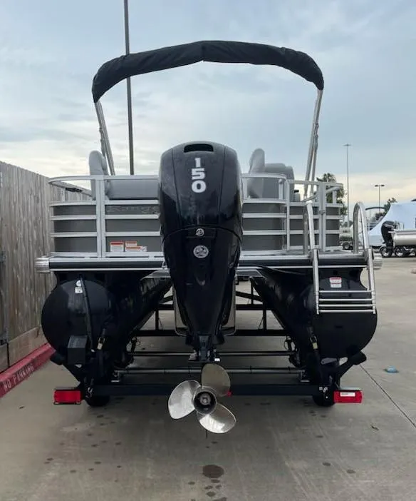 Slide: The Image of 2024 Ranger Reata 220F pontoon boat with 150 HP outboard motor, rear view. - 7