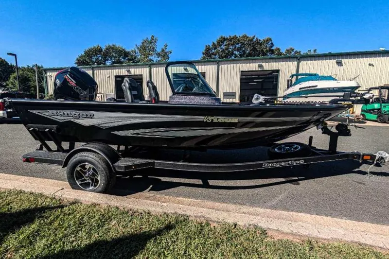 Slide: The Image of 2024 Ranger VS1682SC Angler boat on trailer, parked outdoors. - 4