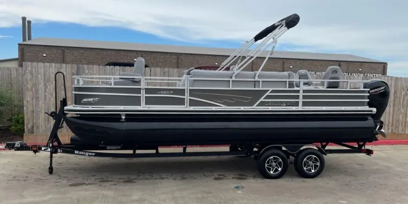 Slide: The Image of 2024 Ranger Reata 220F pontoon boat on trailer, side view. - 1