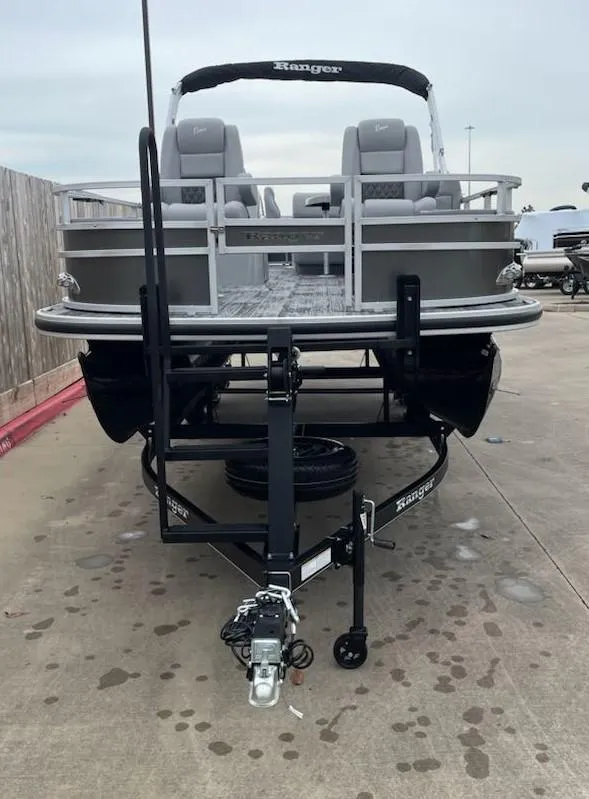 Slide: The Image of 2024 Ranger Reata 220F pontoon boat on trailer, front view. - 2