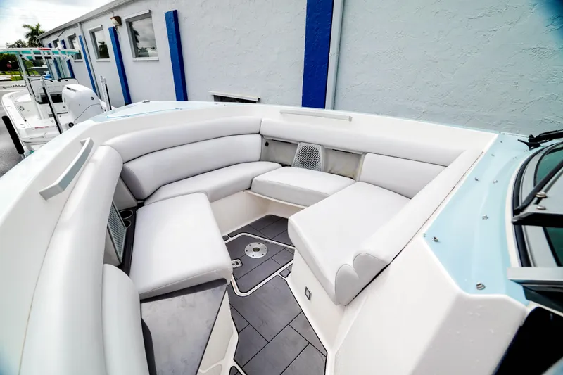 Slide: The Image of Luxurious seating area on 2022 Aviara AV32 OB boat, featuring sleek white upholstery. - 11