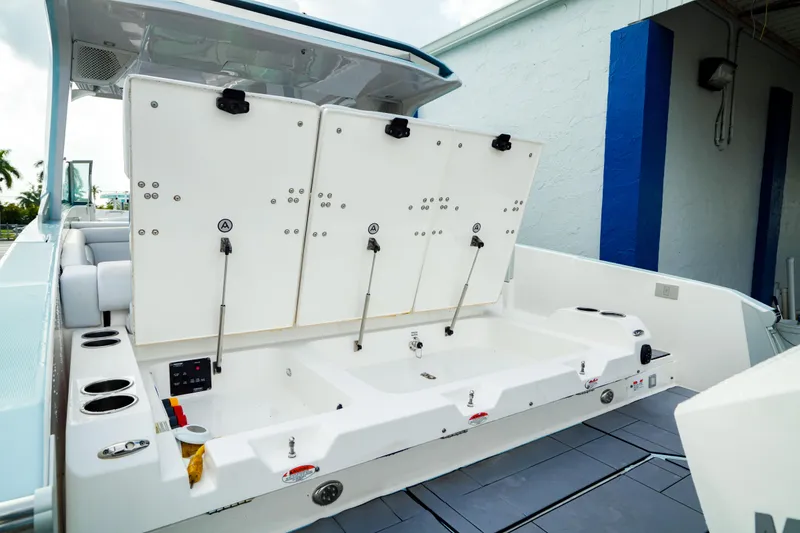 Slide: The Image of 2022 Aviara AV32 OB boat with open storage compartments, sleek design, and modern features. - 14