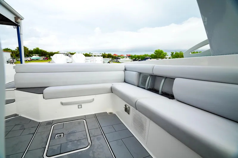 Slide: The Image of 2022 Aviara AV32 OB boat interior with sleek gray seating and modern design. - 22