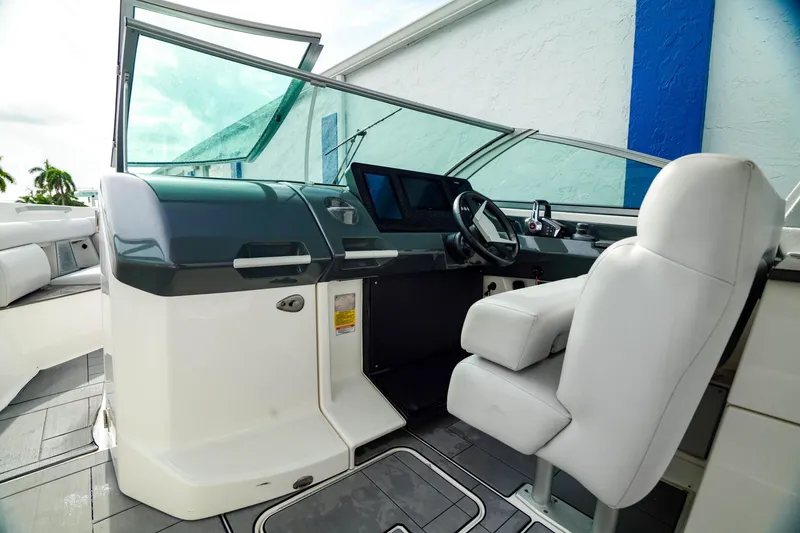 Slide: The Image of 2022 Aviara AV32 OB boat cockpit with modern controls and comfortable seating. - 29