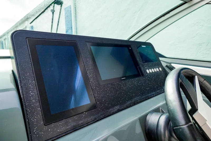 Slide: The Image of Aviara AV32 OB 2022 dashboard with modern touchscreen displays and steering wheel. - 30