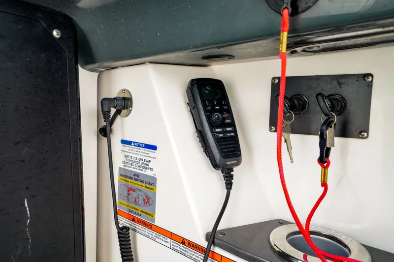 Slide: The Image of Control panel of 2022 Aviara AV32 OB boat with radio and safety features. - 34