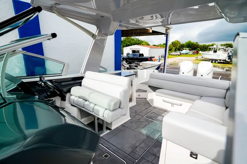 Slide: The Image of 2022 Aviara AV32 OB boat interior with modern seating and dual outboard engines. - 38