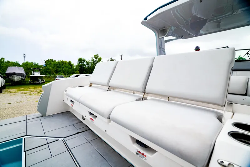 Slide: The Image of 2022 Aviara AV32 OB boat with spacious white seating and modern design. - 47